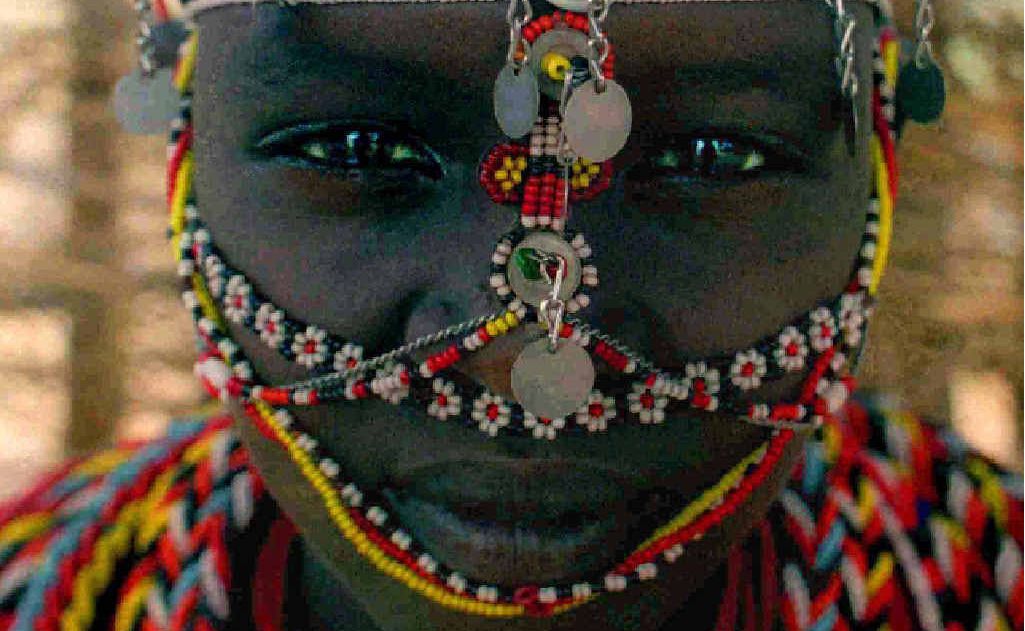 A young Samburu woman from Umoja women’s village in the woman’s only communal area of the village. A young Samburu woman from Umoja women’s village in the woman’s only communal area of the village.